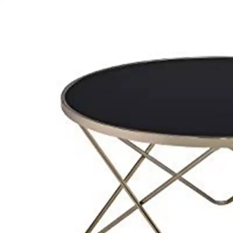 Tavolino rotondo da caffè con piano in vetro nero e base in metallo dorato